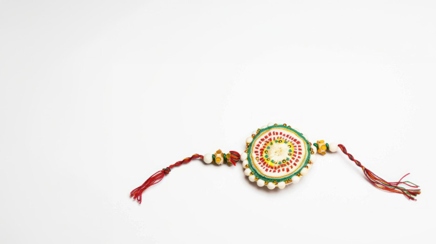 A simple and elegant single line of color featuring indian rakhi symbolizing the raksha bandhan concept