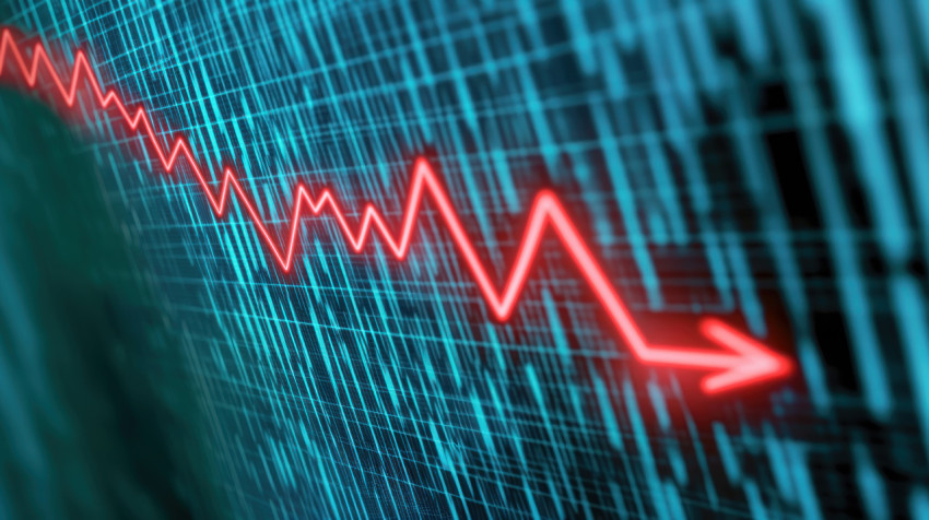 Red line graph on a display screen showing a stock market crashstock market crash recession concept