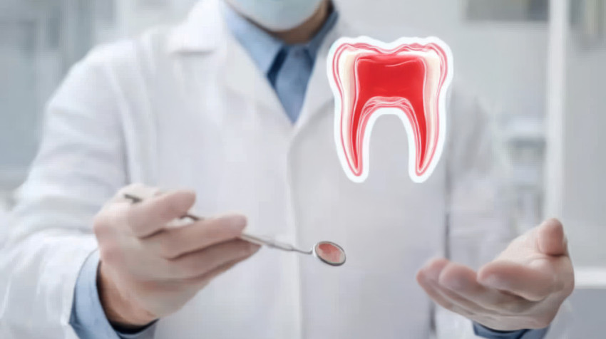 Dental doctor holds virtual dental tools in front with a red tooth hologram floating above