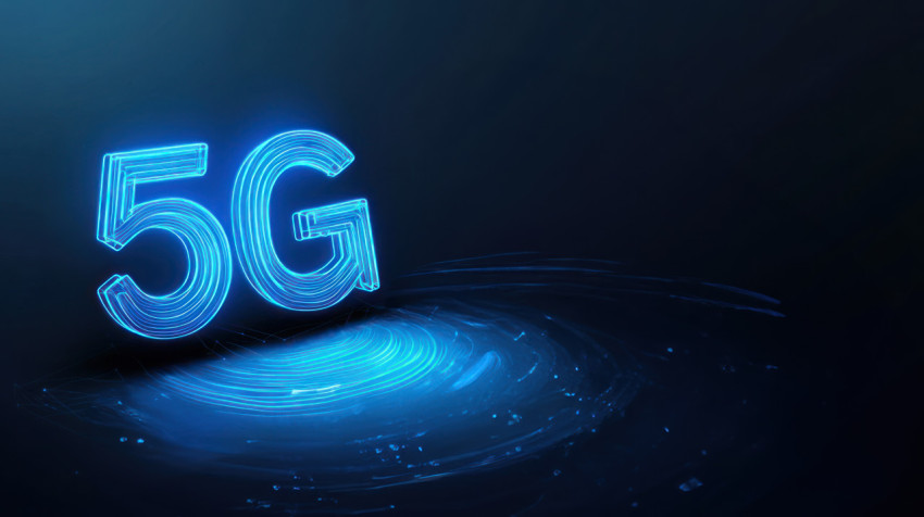 The text 5G in blue neon light with glowing outlines on a dark background