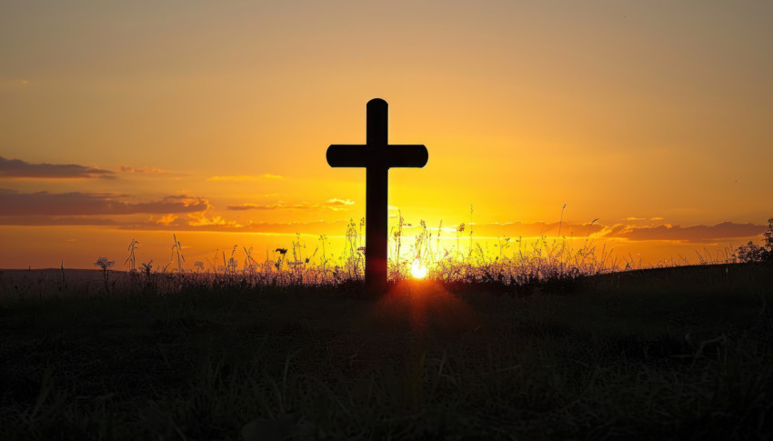 Cross silhouette against a autumn sunset sky