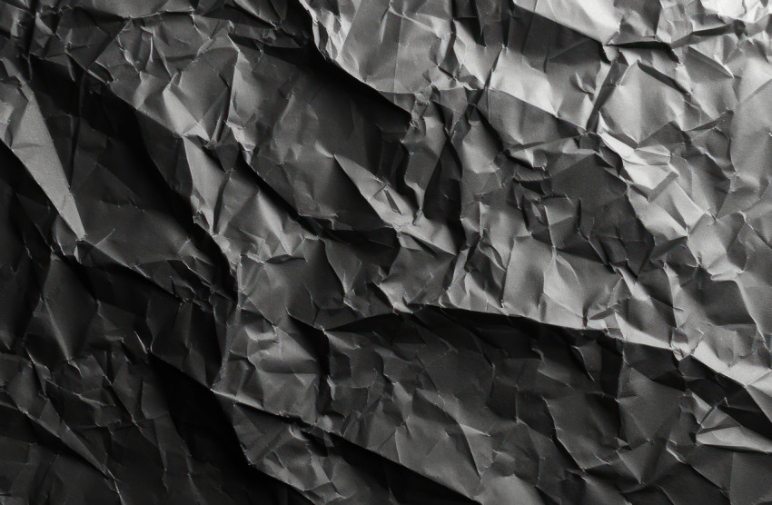 Texture of crumpled black paper background