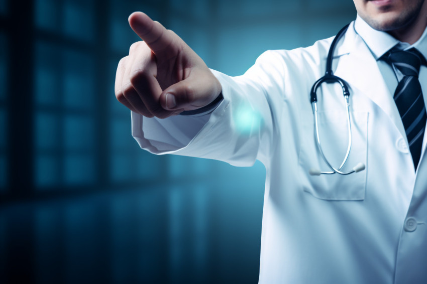 Doctor pointing to a blue hand pointing stock photo, Health and Medical stock image