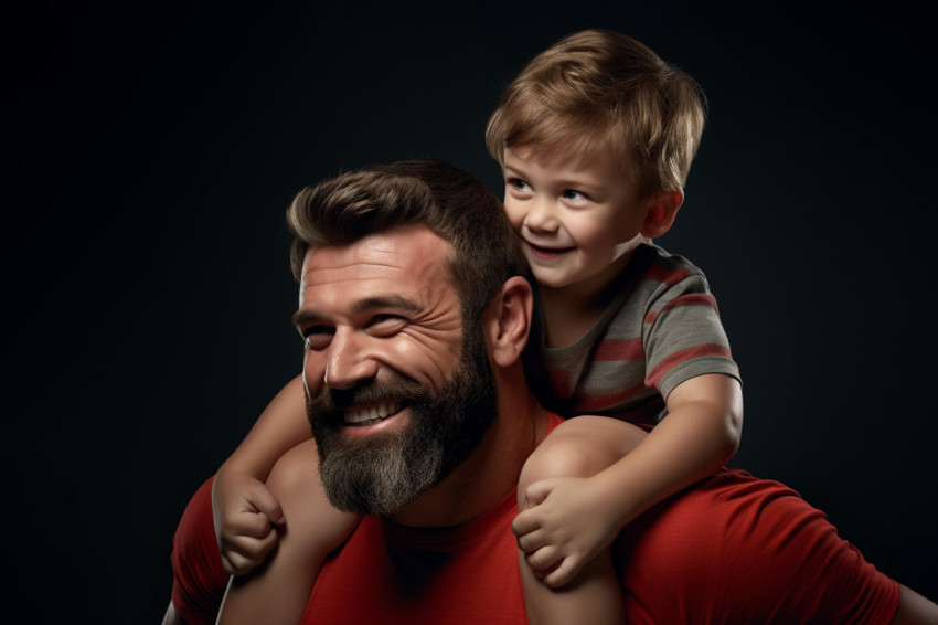 A photo of a young boy sitting on his fathers shoulders flexing