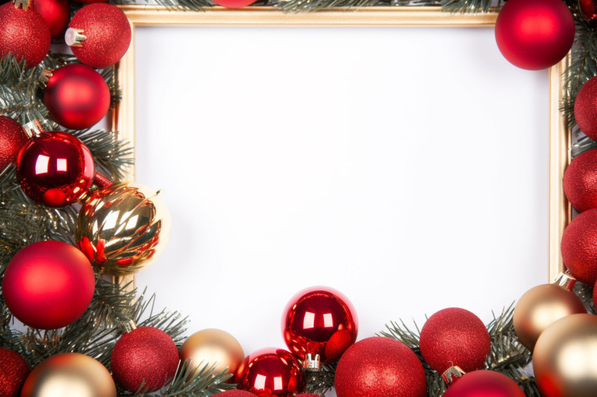 A photo of a Christmas frame made of spruce branches, red and go