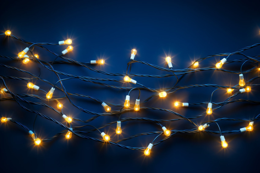 A picture of Christmas lights on a dark blue background