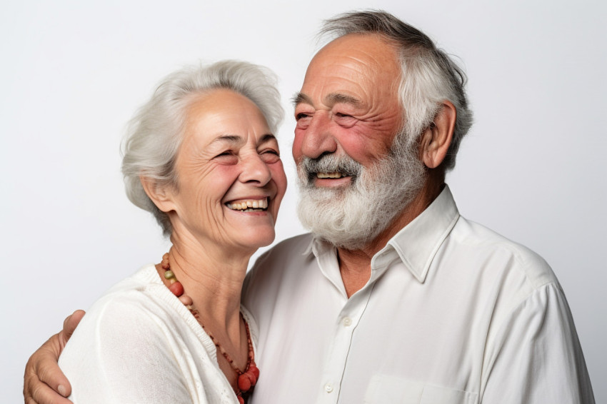 Photo of loving senior couple on white