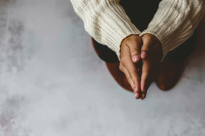 Woman in crisis prays for god blessing seeking a better life