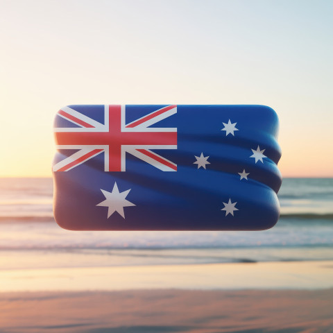 Australian flag icon with soft waves floating gently over a golden beach sunset background