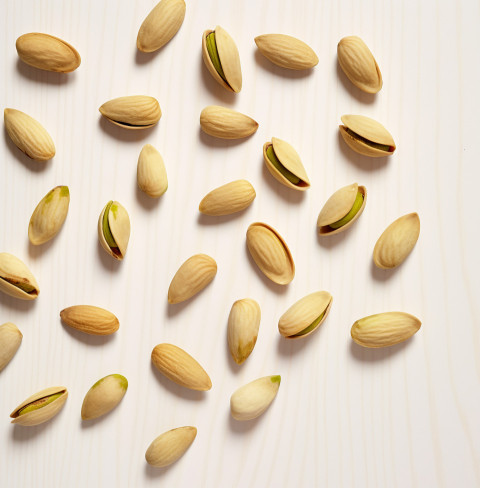 Several Pistachios on a White Background