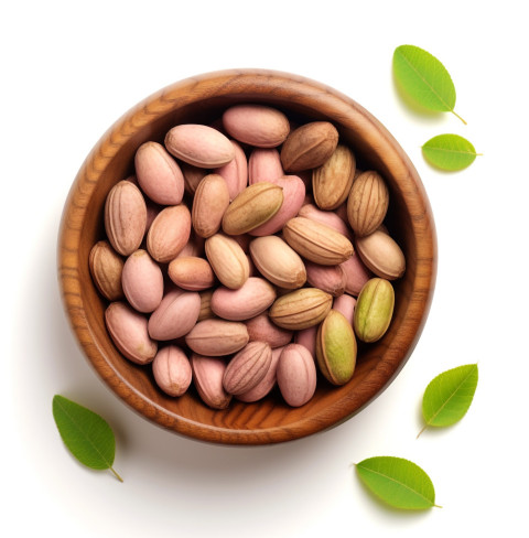 pistachios in a wooden bowl on a white background